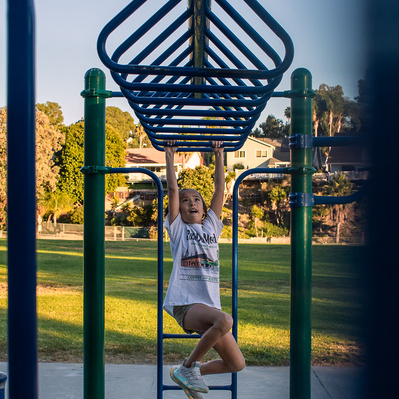 Mars plays on the monkey bars before her play "Annie" where she played an orphan.