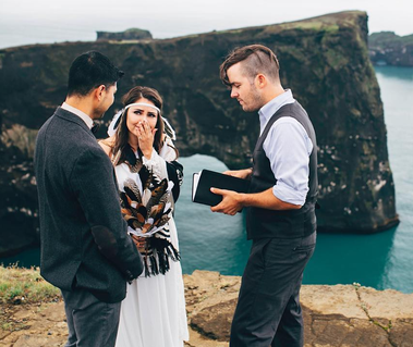iceland bride crying at her groom's beautiful vows at Dyrholaey Arch