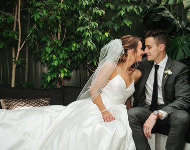 bride and groom kissing at wedding venue planterra in detroit michigan