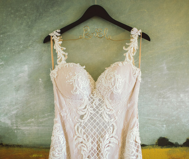 bride's gorgeous lace wedding dress on customized bride hanger