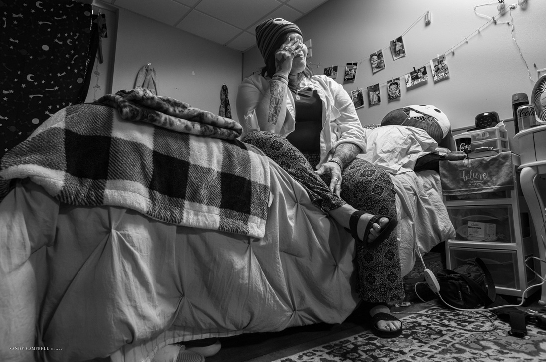 A moment of solitude in her apartment, Kimberly draws strength and comfort from her faith to conquer numerous challenges that have defeated so many.