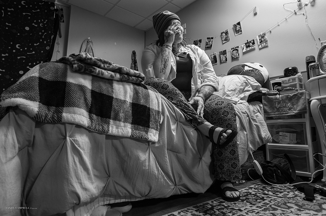 A moment of solitude in her apartment, Kimberly draws strength and comfort from her faith to conquer numerous challenges that have defeated so many.