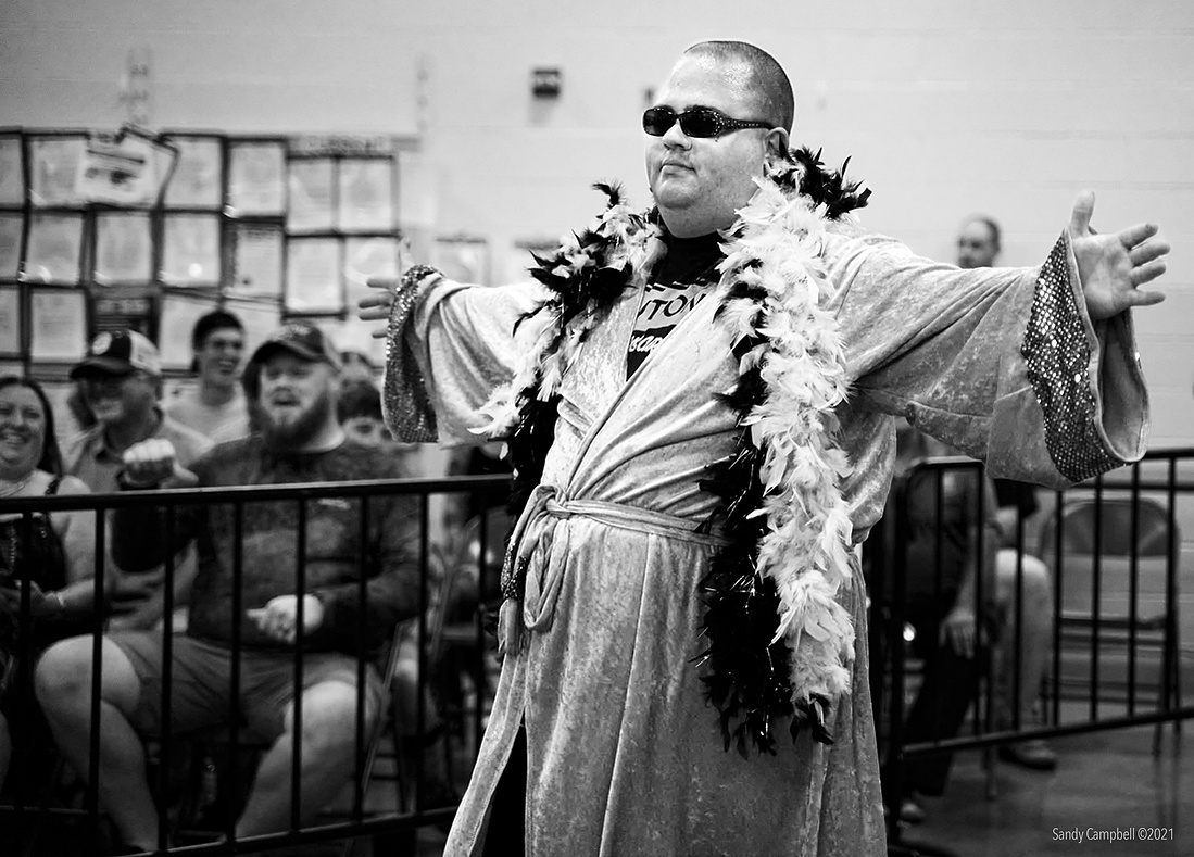 Someone has to be the pretty boy villain that stokes the crowd.