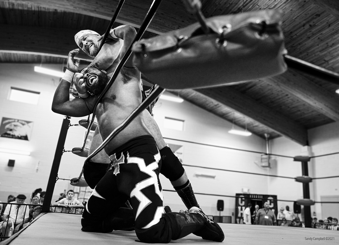 This chokehold and eye gouge stirred the crowd up as cheating.  