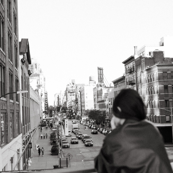 A person overlooking a street of Manhattan.