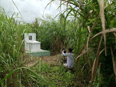 Boone Nguyen, Photographer, Installation Artist, Shooting Video of  his grandfather's grave in Vietnam