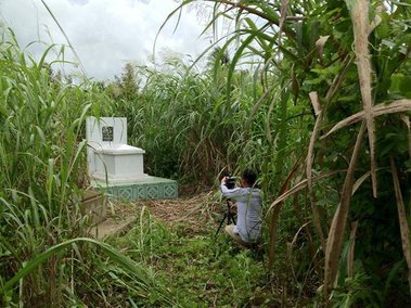 Boone Nguyen, Photographer, Installation Artist, Shooting Video of  his grandfather's grave in Vietnam