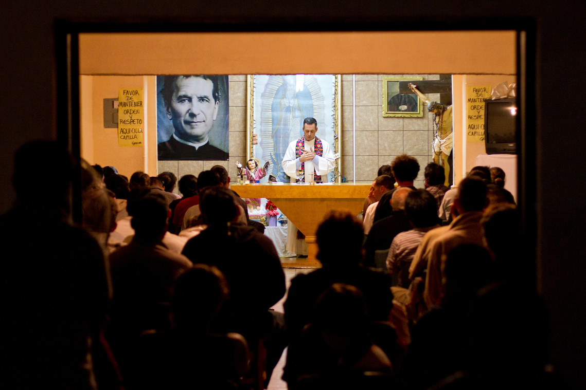 A Saturday night mass is held at San Juan Bosco. The shelter is one of the many deportee shelters in Nogales, Sonora. At San Juan Bosco, shelter is provided to more than 50 recently-deported migrants for at least three nights.