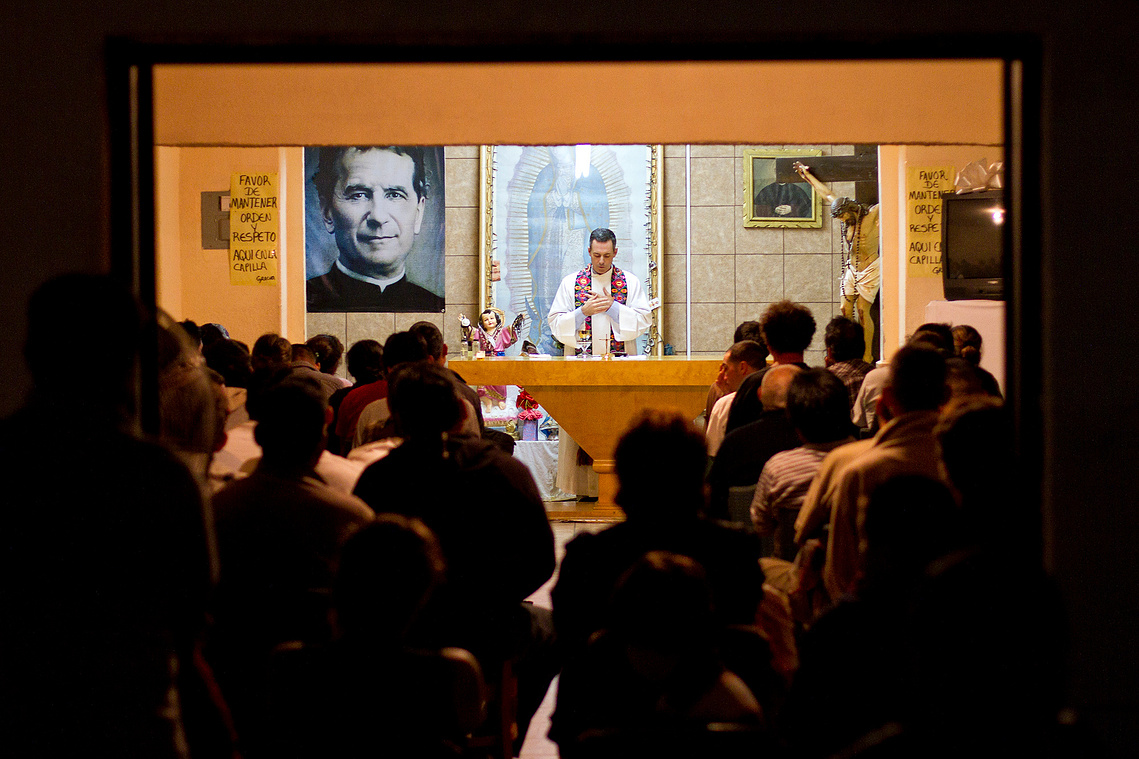 A Saturday night mass is held at San Juan Bosco. The shelter is one of the many deportee shelters in Nogales, Sonora. At San Juan Bosco, shelter is provided to more than 50 recently-deported migrants for at least three nights.