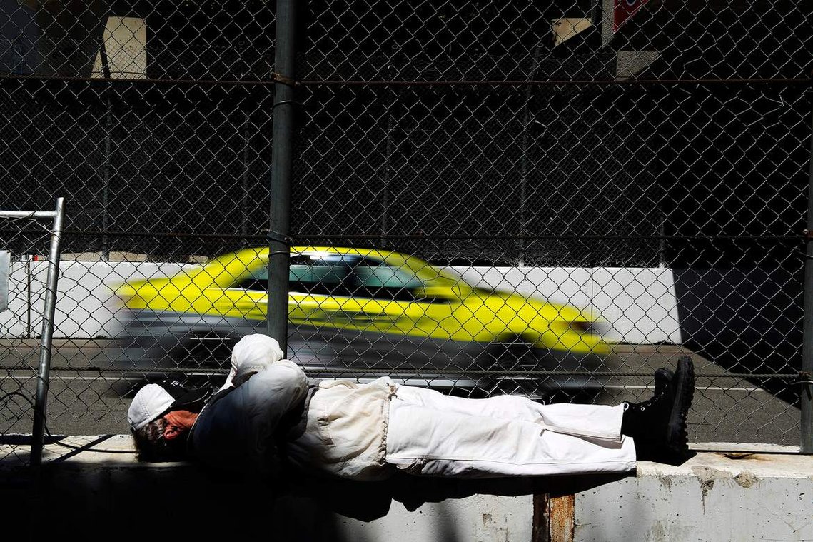 Richard Wood takes a moment to nap before the start of the INDYCAR practice on the first day of the Toyota Grand Prix of Long Beach on April 11, 2014. 