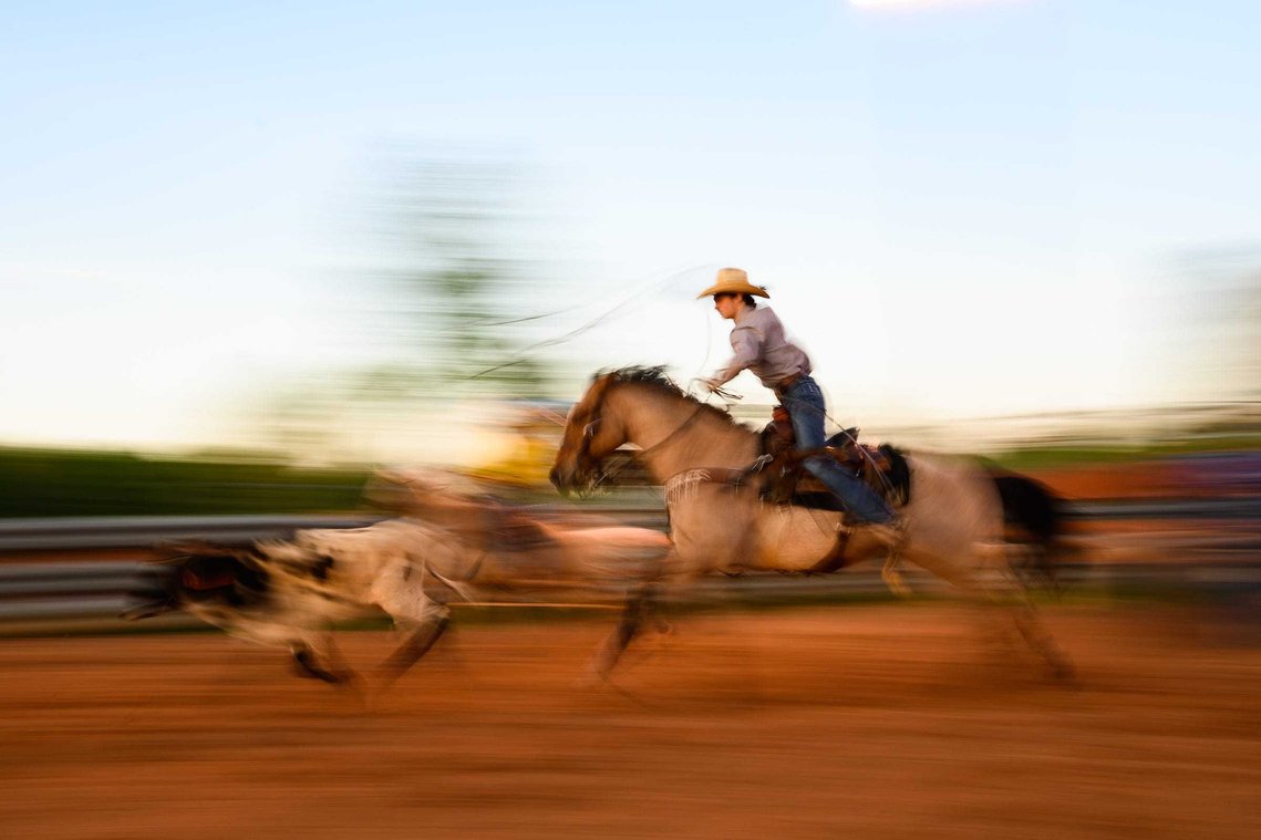 Colton Schlock chases after a calf as he practices team roping at J-Rest Farms Thursday, April 15, 2021.