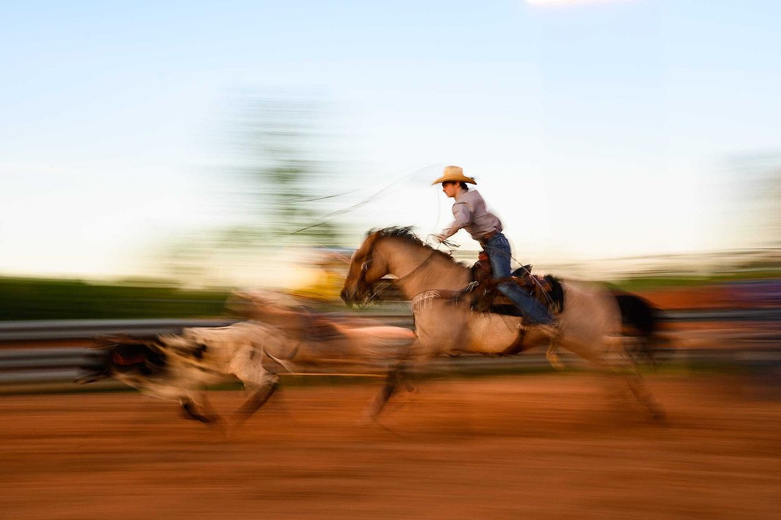 Colton Schlock chases after a calf as he practices team roping at J-Rest Farms Thursday, April 15, 2021.