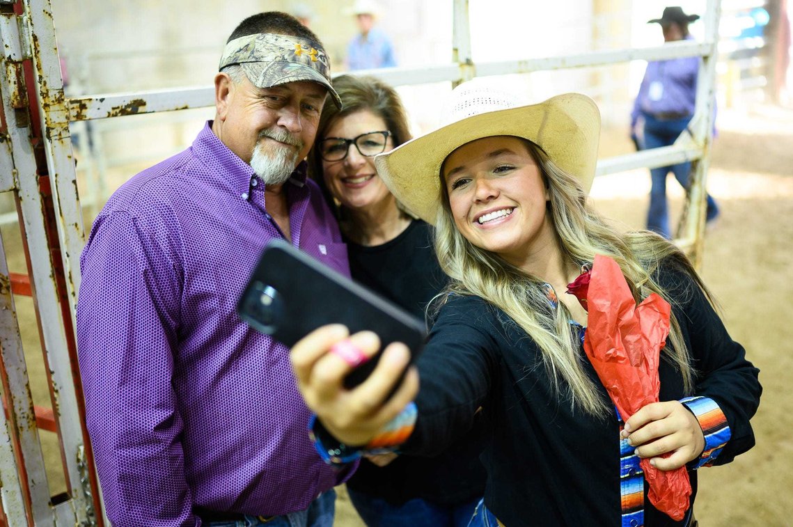 Sally Poteat takes a selfie with her parents Warren and Elizabeth during senior night at the state rodeo finals in Clemson Friday, May 21, 2021.