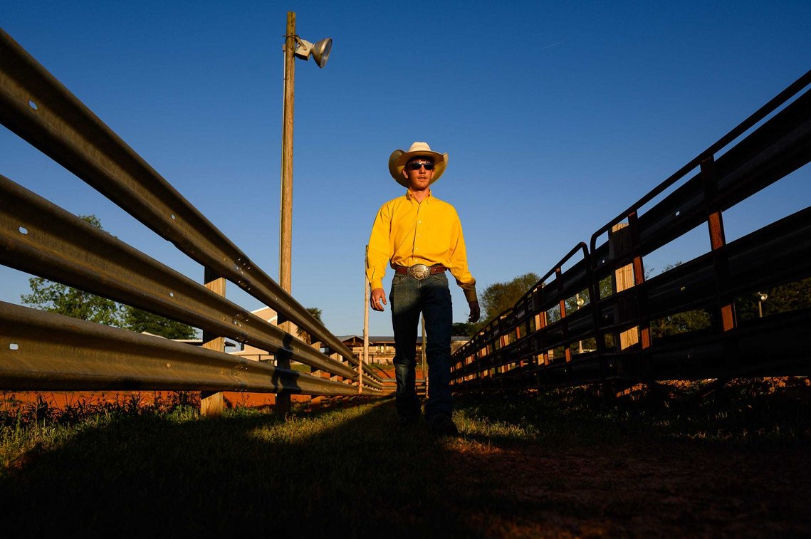 Reign Dobbins walks to gather calfs for roping practice at J Rest Farm Thursday, April 15, 2021.