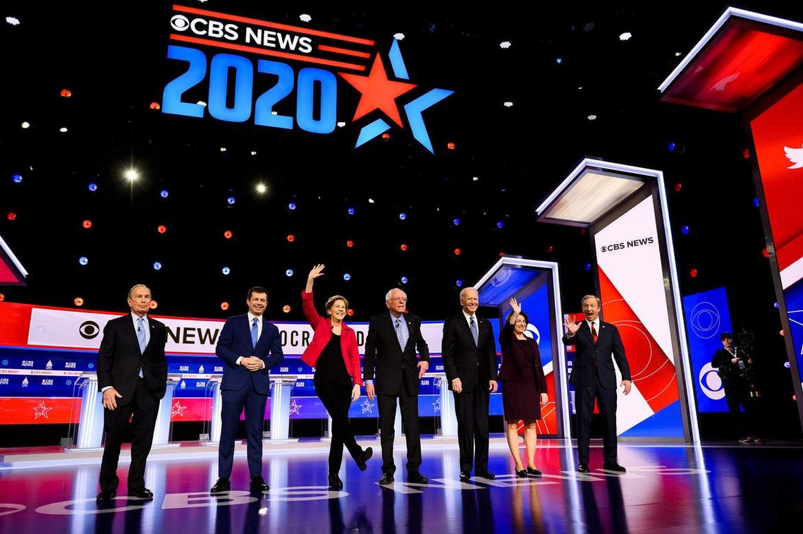Democratic presidential candidates Michael Bloomberg, Pete Buttigieg, Elizabeth Warren, Bernie Sanders, Joe Biden, Amy Klobuchar and Tom Steyer walk onto the stage during the South Carolina Democratic debate in Charleston Tuesday, Feb. 25, 2020.