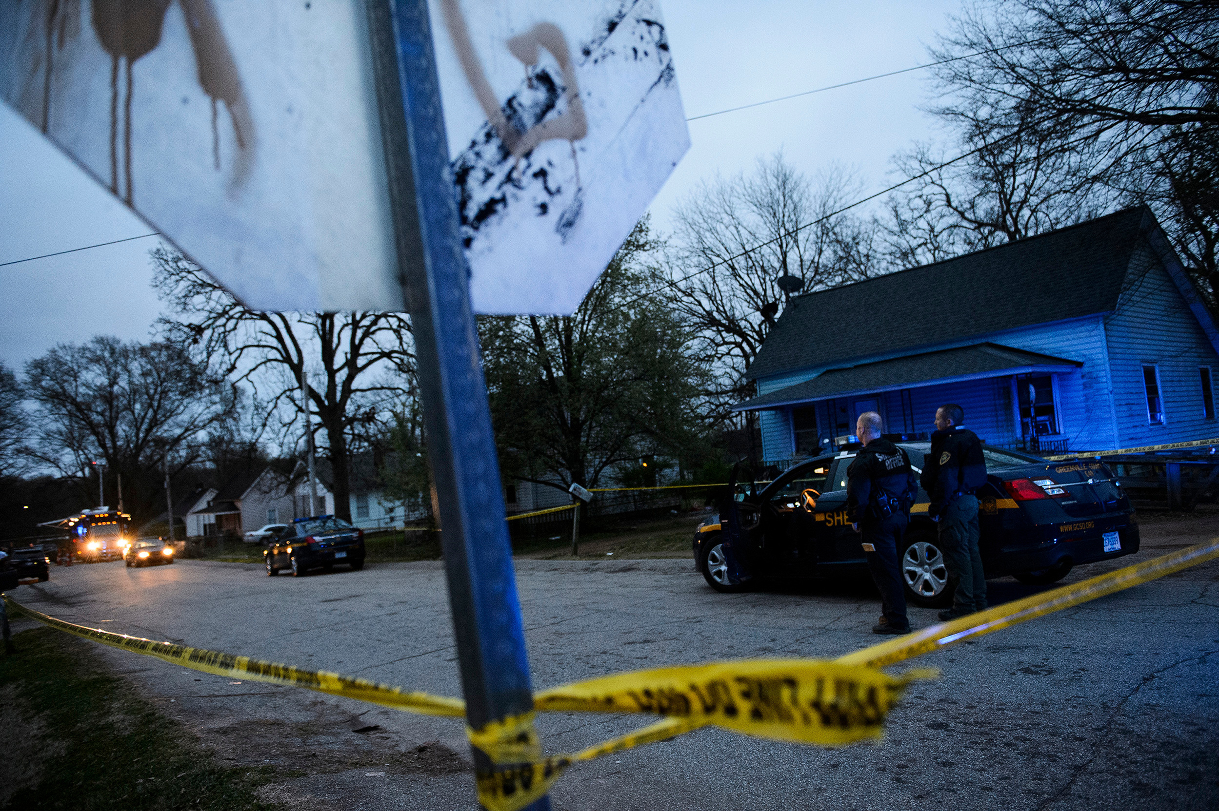 Greenville County Sheriff's Department officers investigate the scene of an officer-involved shooting near Poe Mill on Monday, March 19, 2018.