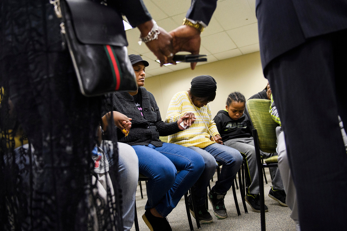 Family and loved ones of Jermaine Massey pray after a press conference addressing the Greenville County Sheriff's Office to address mental illness training on Tuesday, April 3, 2018.
