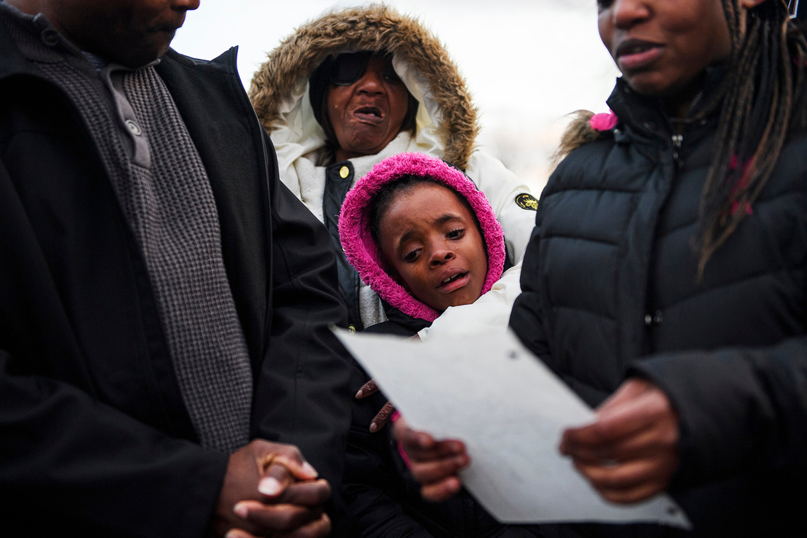 Jekeriah Massey, 8, cries as her aunt, Tamika Gordon, reads a poem she wrote for her father, Jermaine Massey, during a vigil for him outside of his home on Wednesday, March 21, 2018. Published Monday, Sept. 30, 2019.