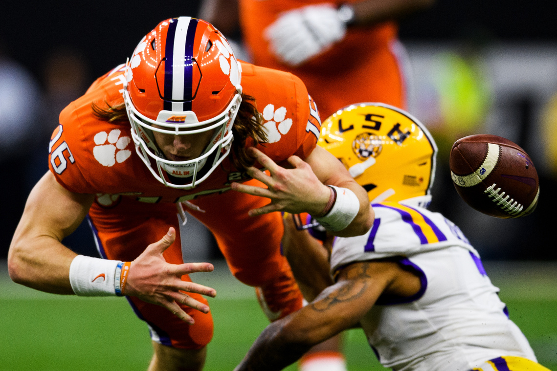 Clemson quarterback Trevor Lawrence (16) fumbles the ball after getting hit by LSU defensive back Grant Delpit (7) during the College Football National Championship game at the Mercedes Benz Superdome Monday, Jan. 13, 2020.