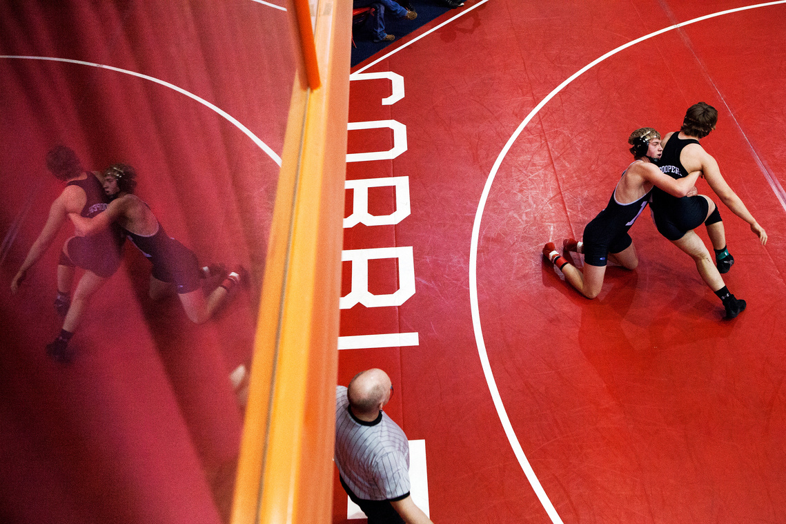 Sturgis Brown High School's Jake Vinson attempts to escape the grip of Isaac Fleck of Mandan High School in Mandan, N.D. during the first day of the Rapid City Invitational Wrestling Tournament on Friday, Dec. 12, 2014 at the Rushmore Plaza Civic Center.