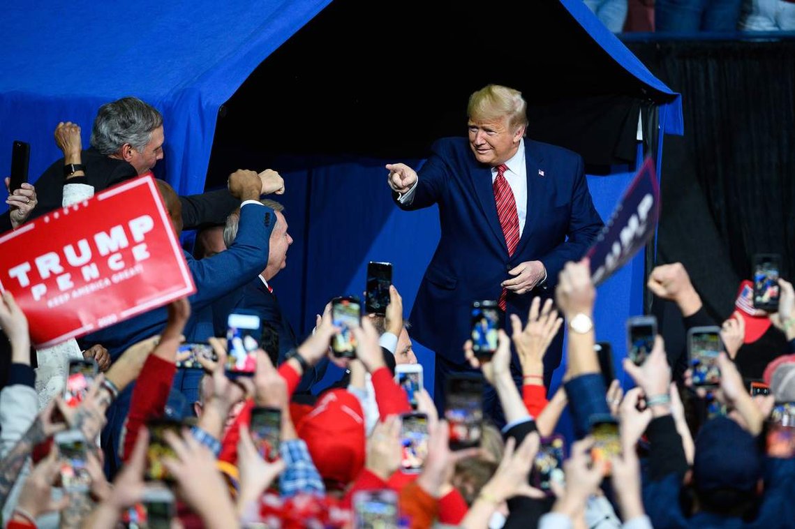 President Donald Trump points to supporters during a rally at the North Charleston Coliseum Friday, Feb. 28, 2020.