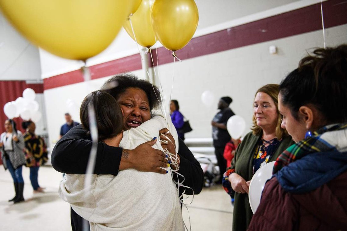Jacqueline Brown is embraced by Angela Stone at Clearview Baptist Church during a vigil held in honor of Brown's four children who died due to a DUI wreck on Friday, Dec. 14, 2018.