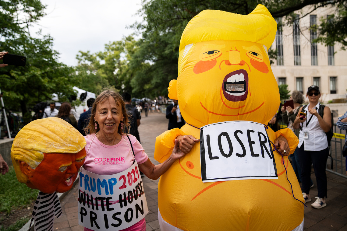 Demonstrators show up for former President Donald Trump's third criminal indictment at the Elijah Barrett Prettyman U.S. Courthouse in Washington D.C. The Department of Justice's investigation into the Jan. 6 insurrection brought four counts against Trump