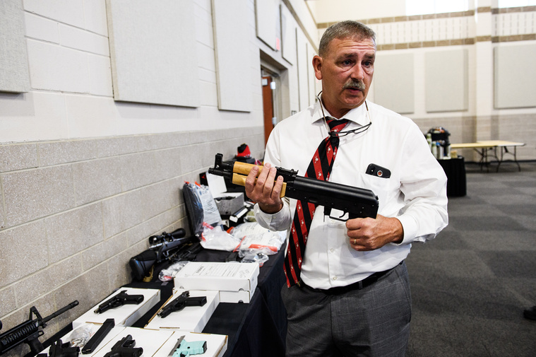 Spartanburg County Sheriff Chuck Wright holds one of the illegal guns seized during Operation Rolling Thunder during a press conference on Friday, May 4, 2018.