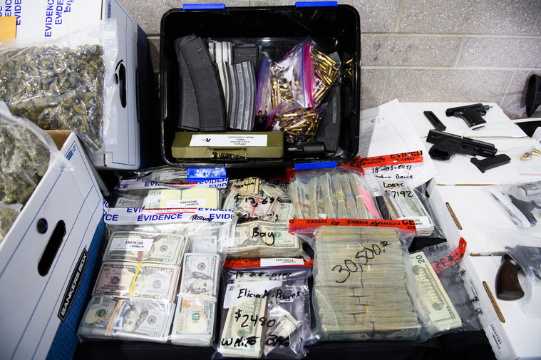 A collection of seized weapons, drugs and money are on display during a Spartanburg County Sheriff's Office press conference on Operation Rolling Thunder Friday, May 4, 2018.