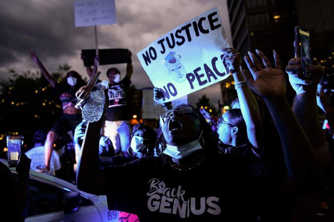 Protestors in downtown Greenville  join thousands of others in a demonstration against police brutality in the wake of George Floyd's death Saturday, May 30, 2020.