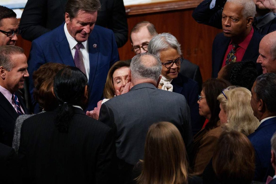 House speaker Nancy Pelosi receives a kiss on the cheek from Senate majority leader Chuck Schumer after she delivered a speech on the House floor declaring she will step down from her leadership role Thursday, Nov. 17, 2022.