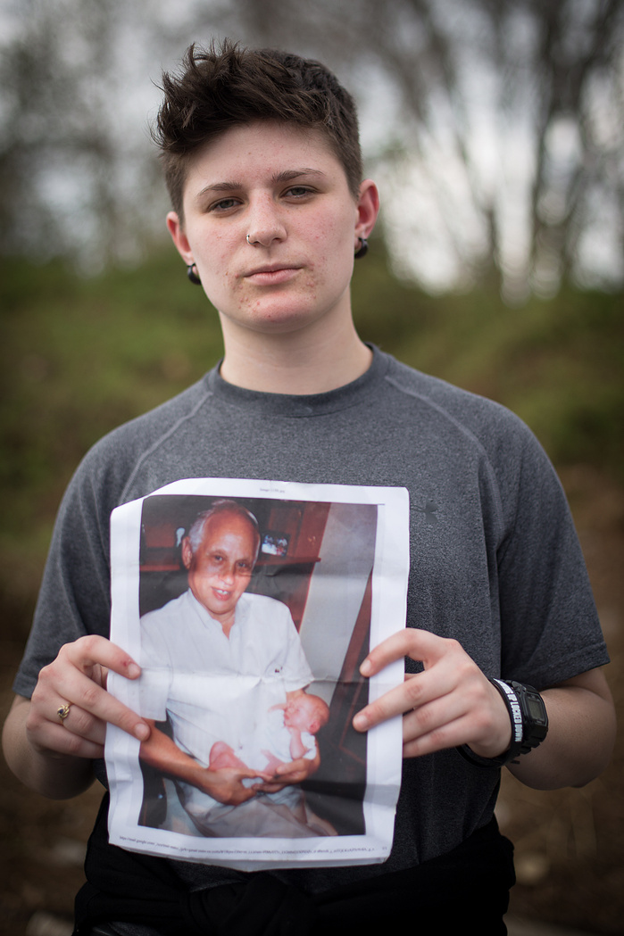 Shana Salzberg, 22, poses with a picture of her grandfather, a survivor of the Holocaust. She carried the photo with her through the march as inspiration. "I was brought up in a family where you don't let oppression happen to other people."