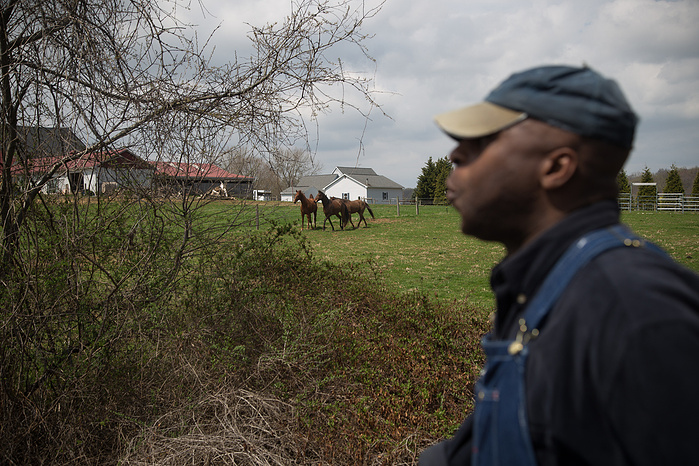 Jason Ford whistles as the march passes a farm in rural Maryland.