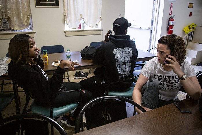 Tamika Mallory and Carlene Pinto work the phones to prepare arrangements for the final days of marching.