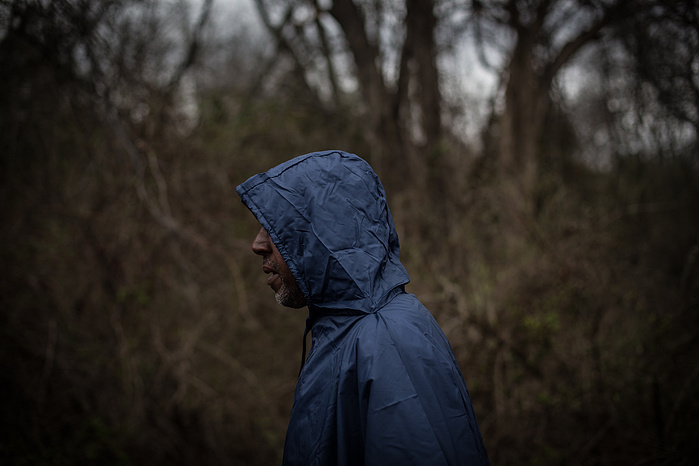 Bruce Richard marches in a raincoat in Mercer County, New Jersey.