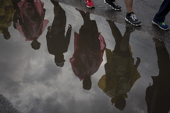 Marchers make their way down Route 1 in Maryland after a small rainstorm.