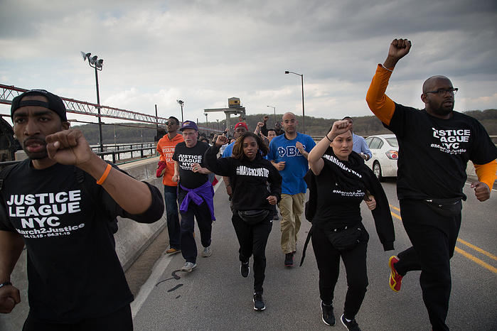 Marchers run across the Conowingo Dam Bridge in northeastern Maryland. The police had warned the marchers not to take the bridge or they would face arrest. The marchers took it anyway, dashing across the kilometer-long span to avoid being boxed in. Ultima