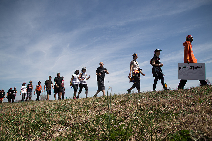 Marchers make their way down Route 1 in rural Harford County, Maryland.
