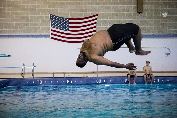 After a very long day of marching, the staff at Lincoln University was kind enough to keep the pool open late. Six-foot-eight, 375-pound Quadir Lateef took full advantage of the diving board.