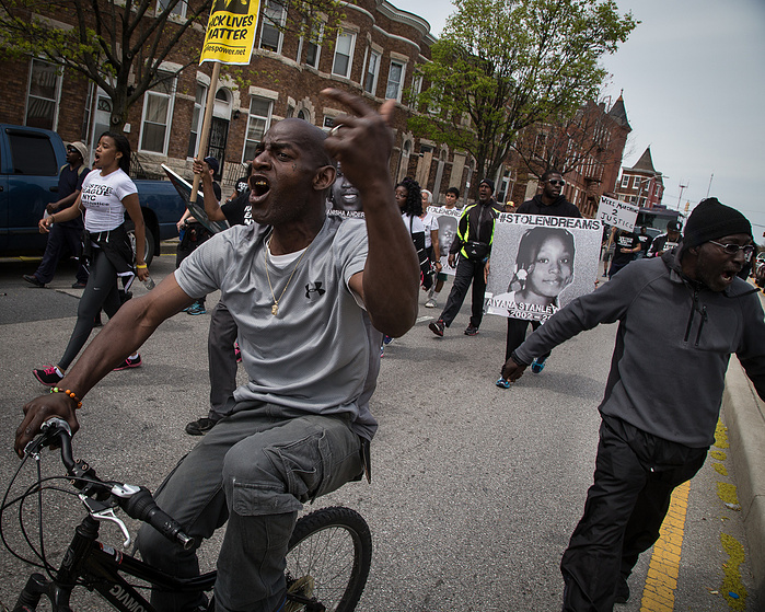 Baltimore residents outraged by the death of Freddie Gray fall in with the marchers as they head towards the Western District.