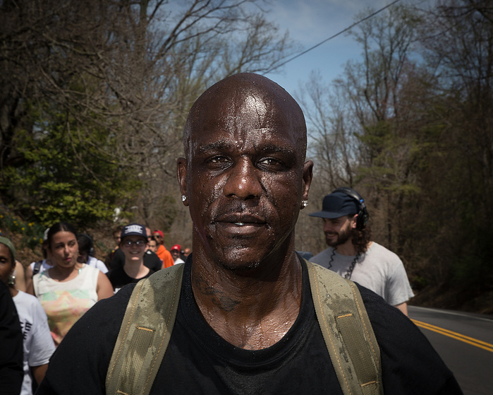 Ron Fletcher keeps cool while marching in 80 degree heat in Harford County, Maryland.