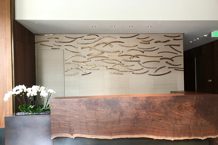 Closer view of the Catalpa Wall Installation commission for The Avery in San Francisco. The large-scale ceramic wall sculpture behind the front desk was made of stoneware by Kathy Erteman, one of a number of her architectural commissions