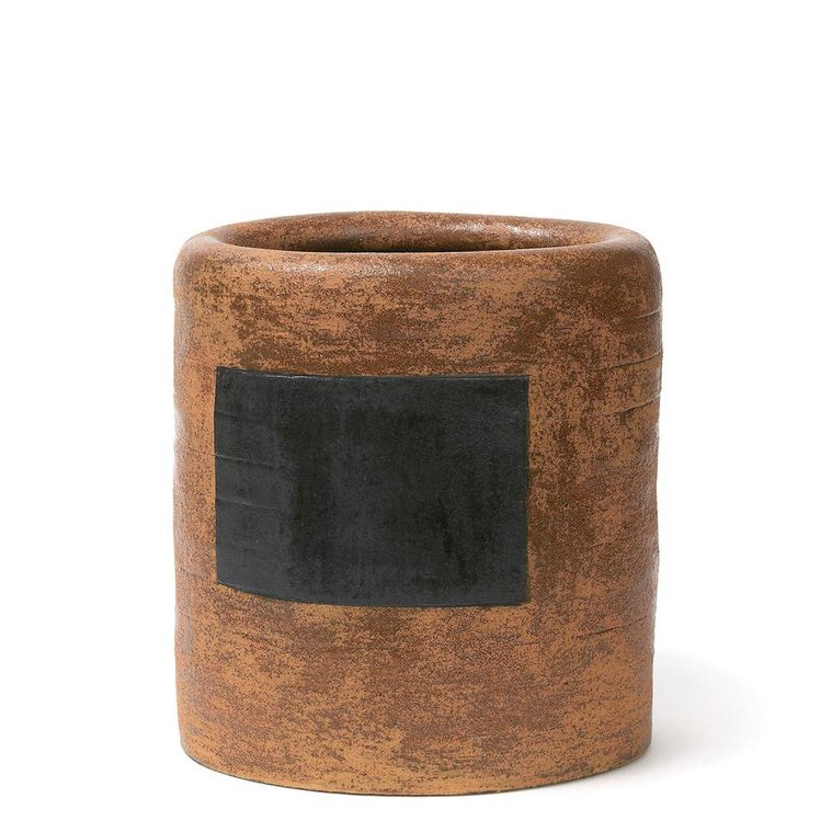 Kathy Erteman’s Persimmon Vessel is a hand-built stoneware sculptural vessel with a persimmon texture glaze. The oval work of art has an inset black square that is a nod to mid-century abstract painting
