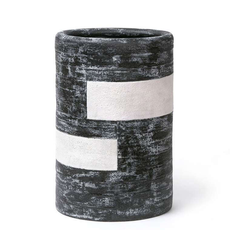 Cinture Vessel 2 is a stoneware vessel made by Kathy Erteman. Hand-built with strips, the tall oval vessel has an inward curl on its rim. It was included in the 2019 International Korean Ceramic Biennale