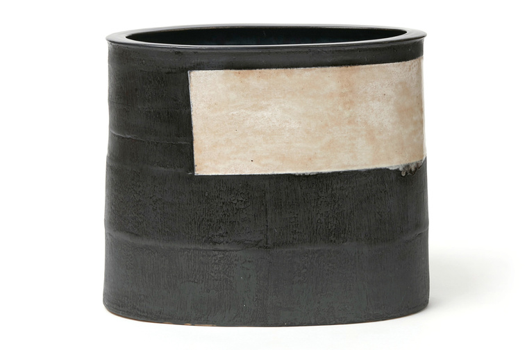 Sash Vessel, a hand-built stoneware work of art with a black glaze and a white glaze inset, was created by Hudson Valley-based artist Kathy Erteman, who is represented by Hostler Burrows Gallery, NYC
