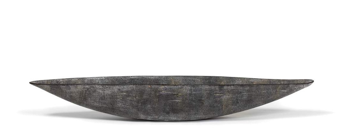 Known for her decorative ceramics, artist Kathy Erteman created Grey Boat Vessel, which she hand-built from stoneware. The gray soot finish is a textural glaze on the slumped slab sculpture that is 36-inches long.