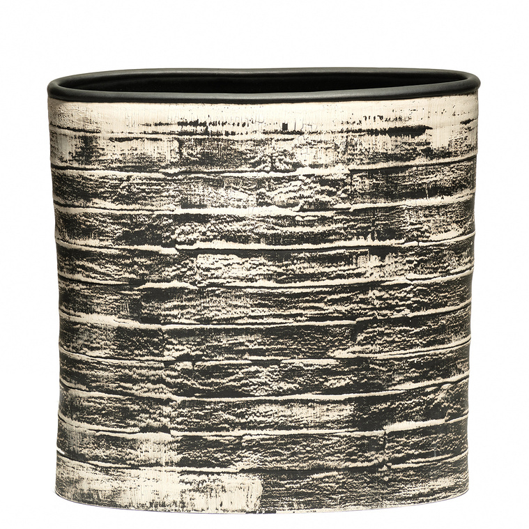 Brush Vessel, an oval stoneware vessel was hand-built in strips by Hudson Valley-based artist Kathy Erteman. The smooth wheel thrown black bead rim, contrast with the textural painted white brushwork of the contemporary al form.