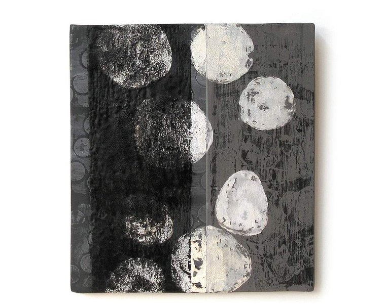 layering ceramic materials in a painterly manner, artist Kathy Erteman created Veil, a porcelain tablet that she slab-built and printed using slips and glaze. This ceramic monotype canvas is a unique piece of sculptural wall art