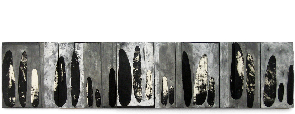 Monoprinting on clay is a process that artist Kathy Erteman developed. She created this ceramic painting called Grey Guanxi 2 with this process, applying color slips to the slab-built panels in a black, white and gray abstract pattern