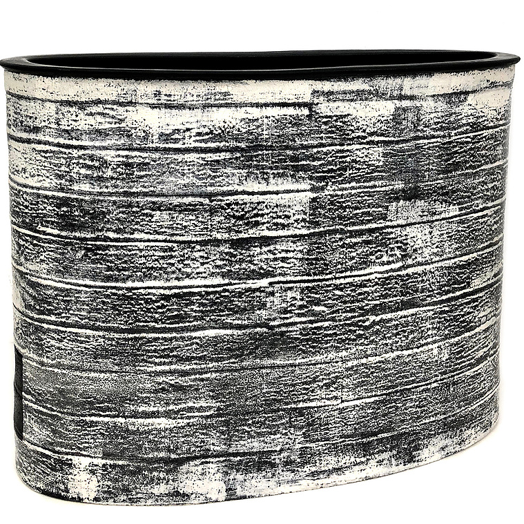 Inspired by abstract expressionism, Kathy Erteman’s Black Frost Vessel is a large oval vessel hand-built from stoneware in strips with a wheel thrown rim and inset black square. The surface has black slip and white slip brushwork